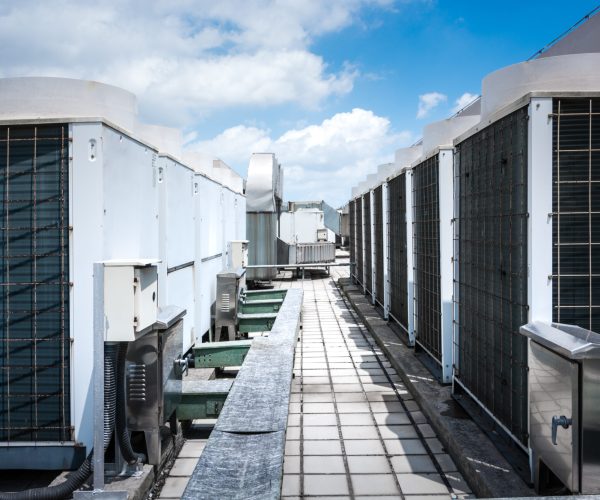 air-compressor-machine-part-air-conditioner-system-roof-deck-with-sky-background.jpg-scaled.jpeg